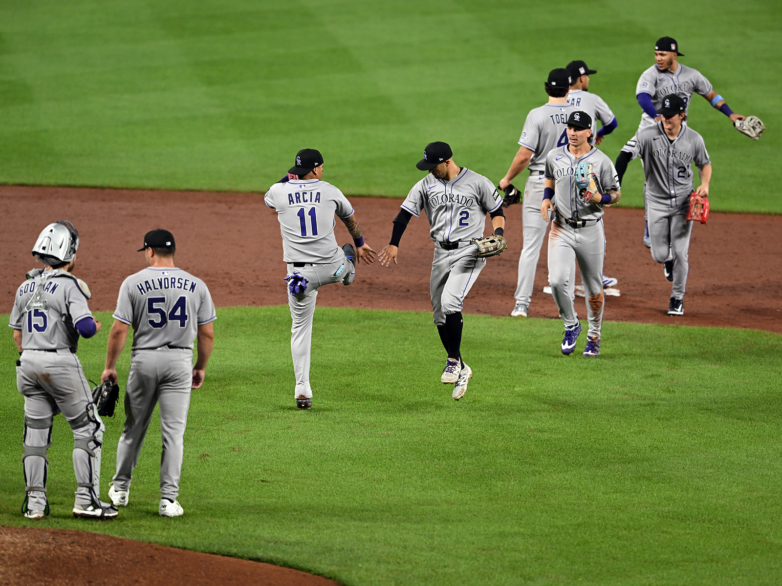 The Colorado Rockies celebrate after a victory