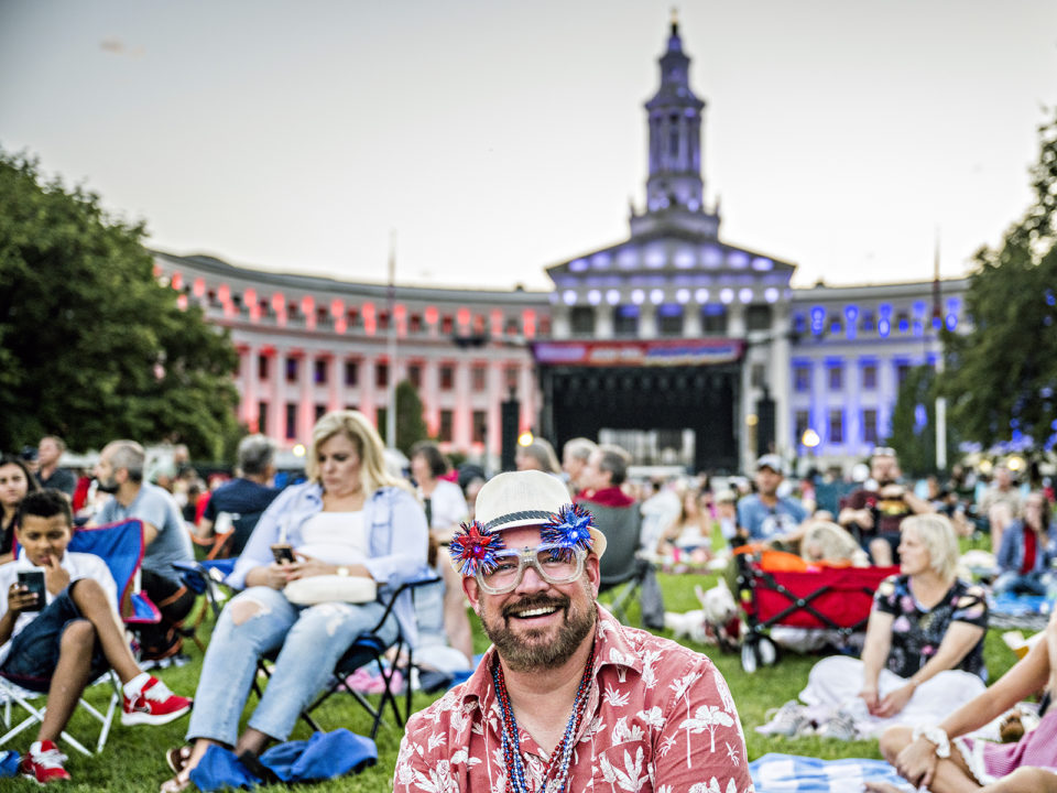 People celebrating Fourth of July at Civic Center Park in Denver