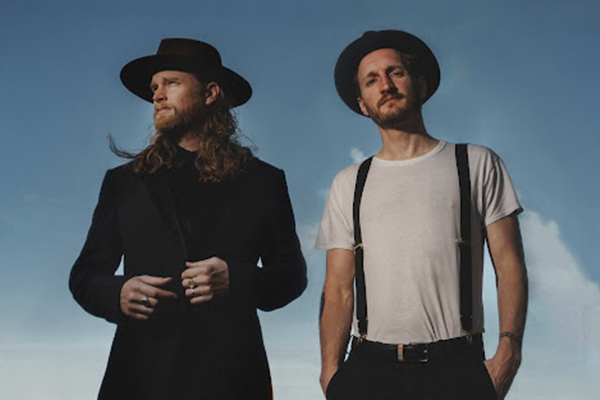 Members of the band The Lumineers, Wesley Schultz and Jeremiah Fraites, posed standing next to each other.