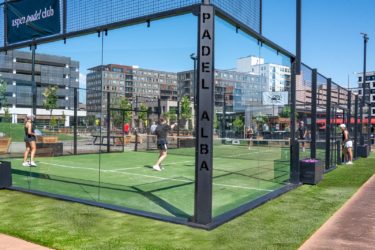 Players with raquets on a padel court