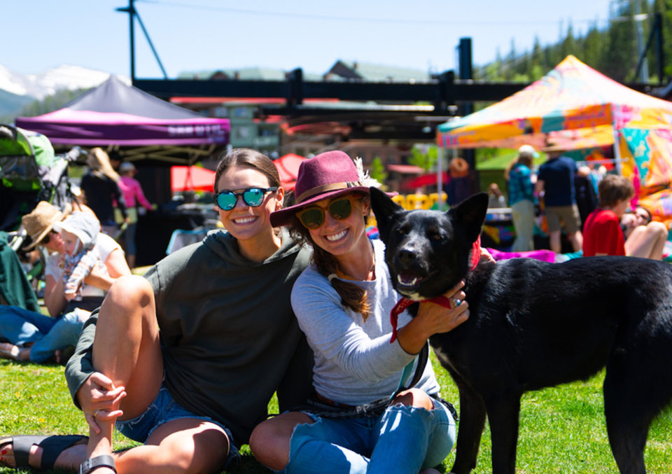 A pair of people pose with their dog at TheBigWonderful Beer Fest
