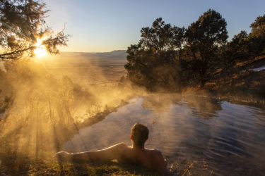 A man soaks at Valley View Hot Springs in Colorado