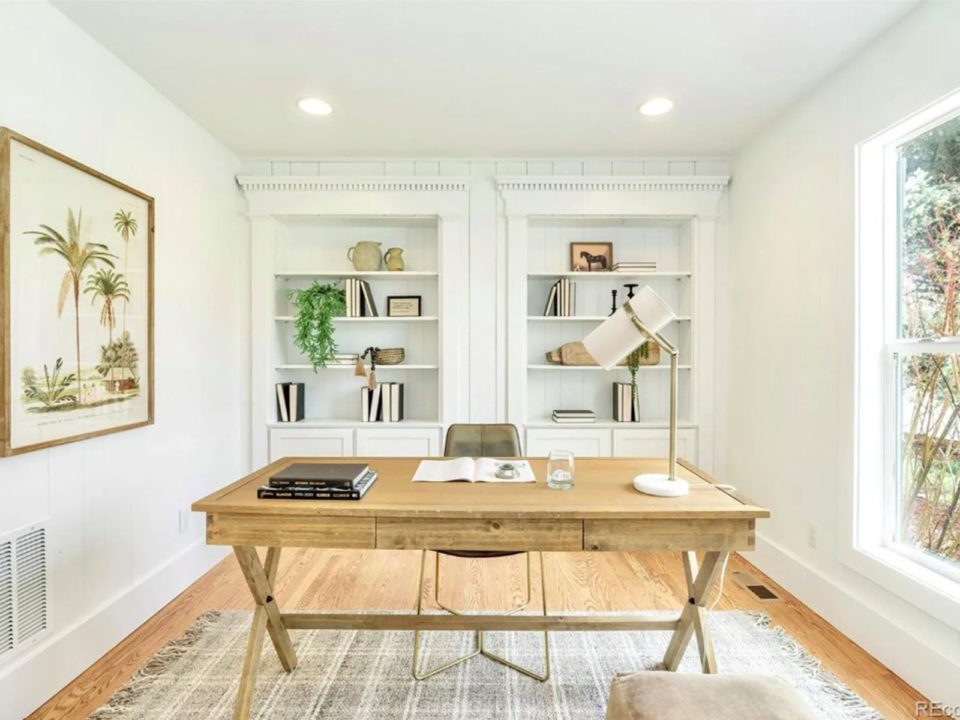 White office with a light wood desk