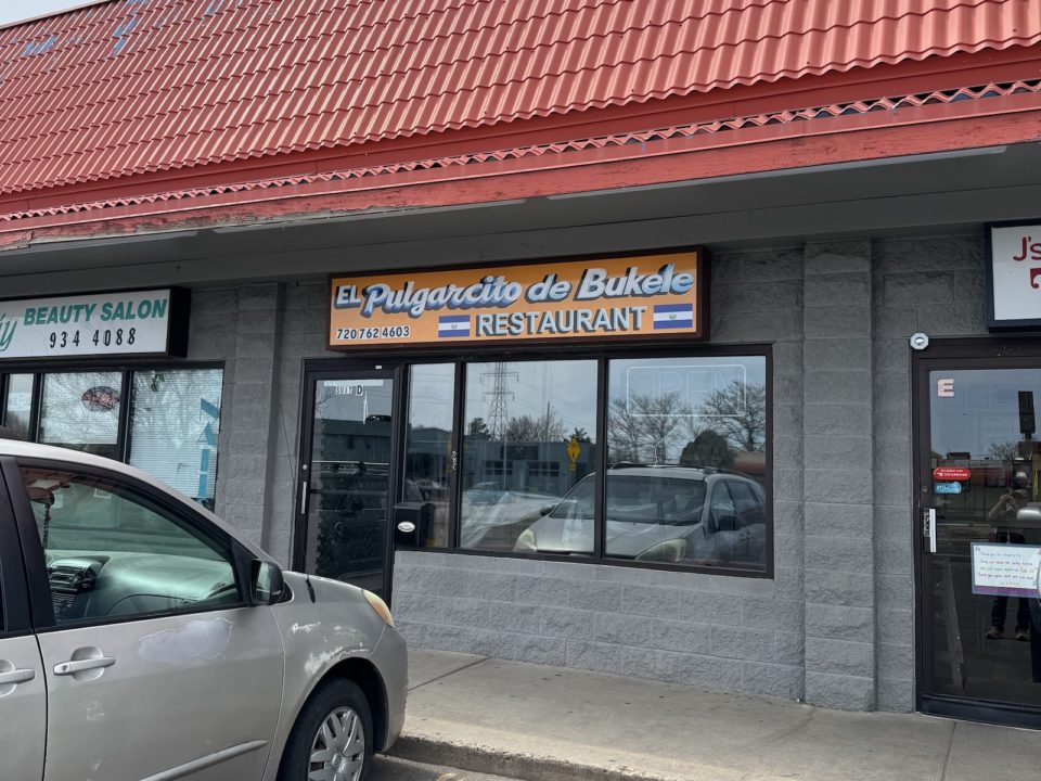 The front of a restaurant with a sign reading El Pulgarcito de Bukele