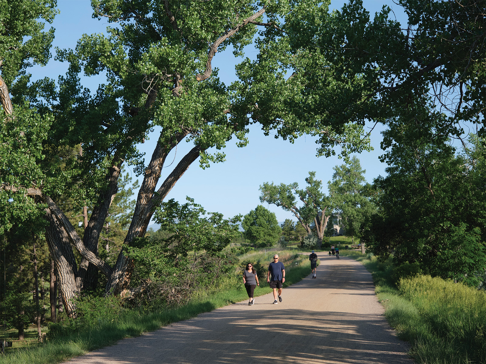 People walking on the High Line Canal trail near Mile 30