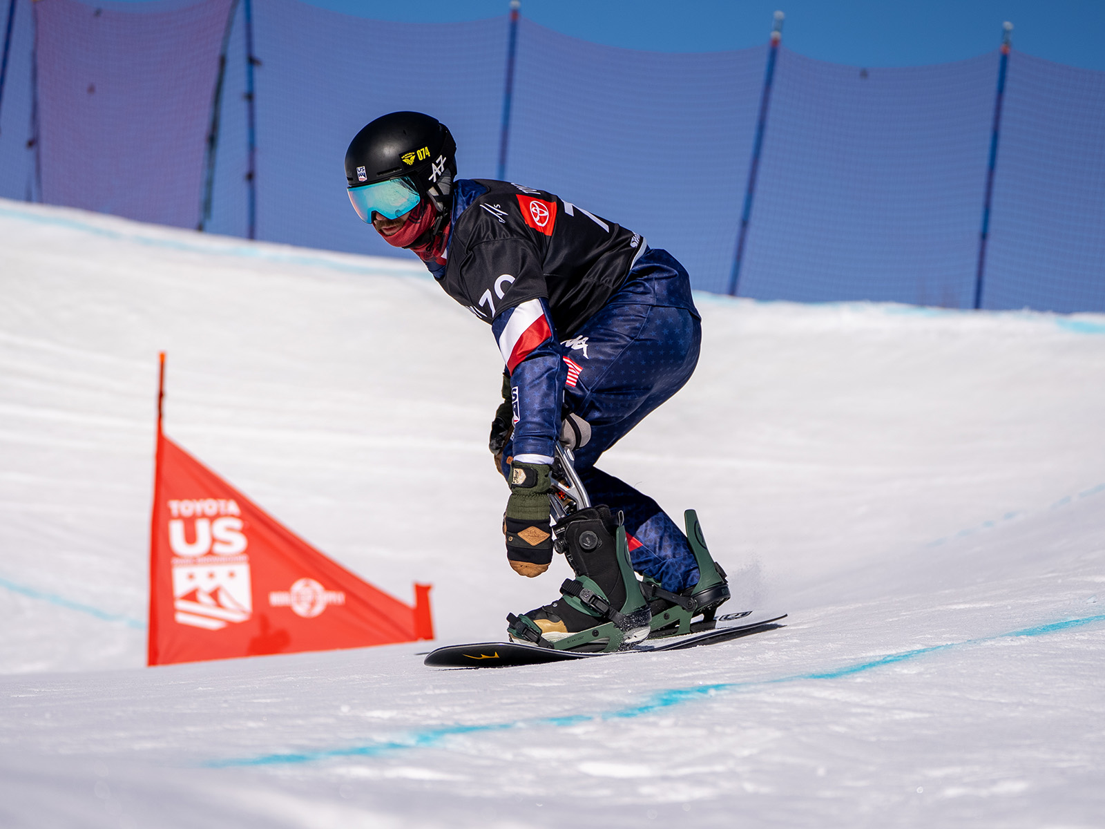 Noah Elliott snowboards in a competition