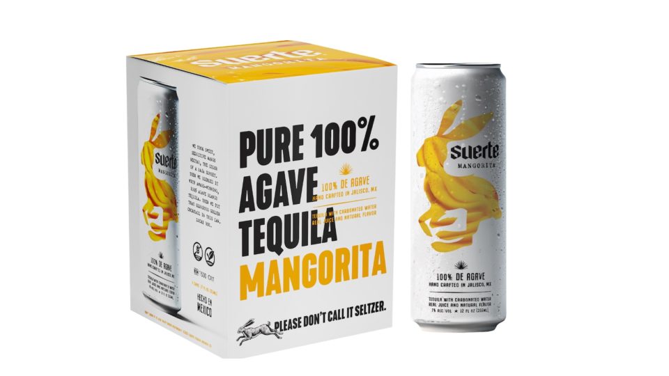 A box of canned tequila cocktails labeled pure 100% agave tequila mangorita with a can next to the box