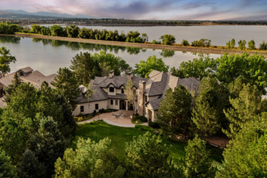Aerial view of a mansion on the water