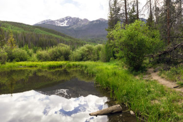 The Tenmile Range reflects into Rainbow Lake in Frisco, Colorado