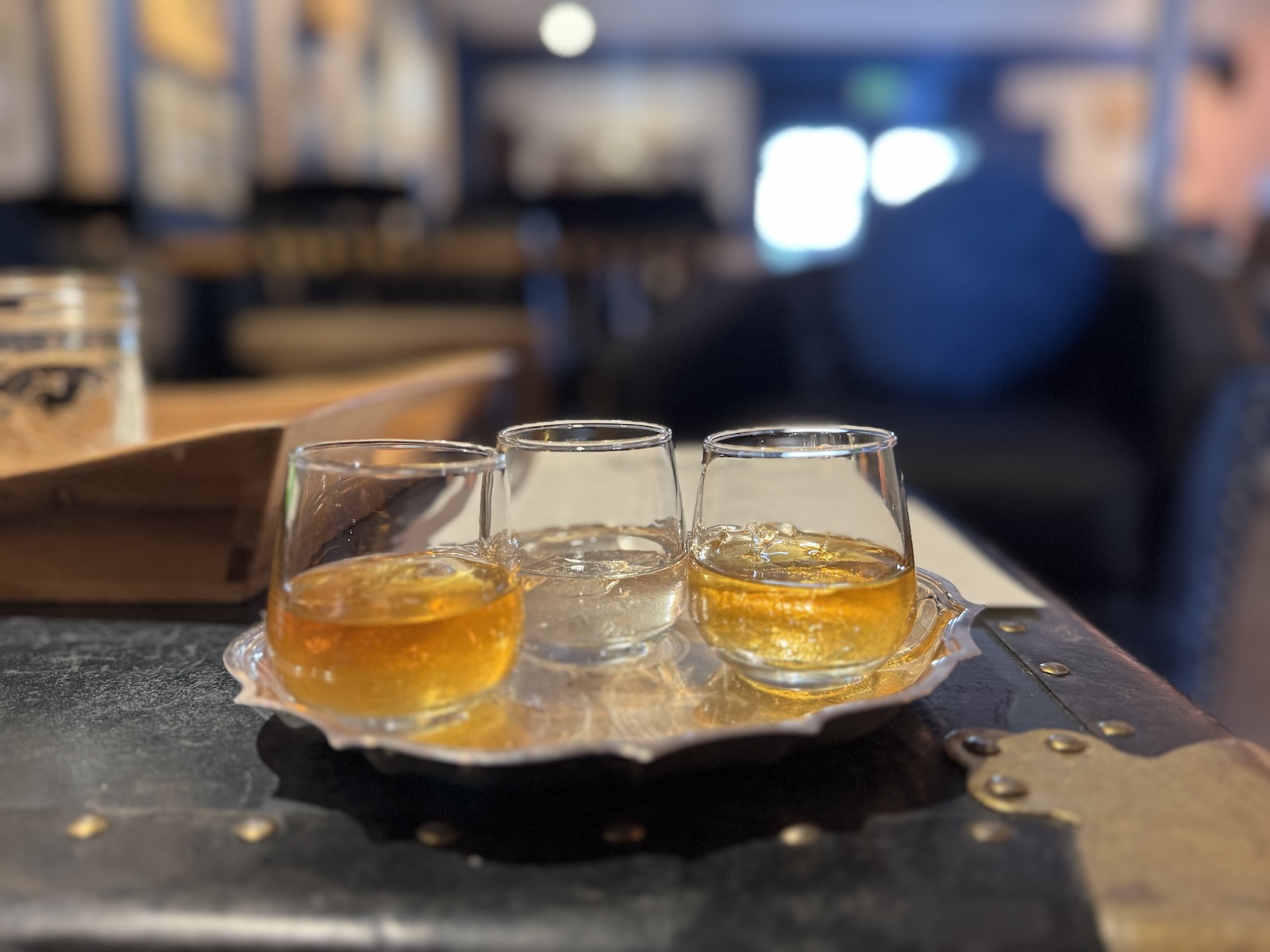 A trio of cocktail samples on a silver tray