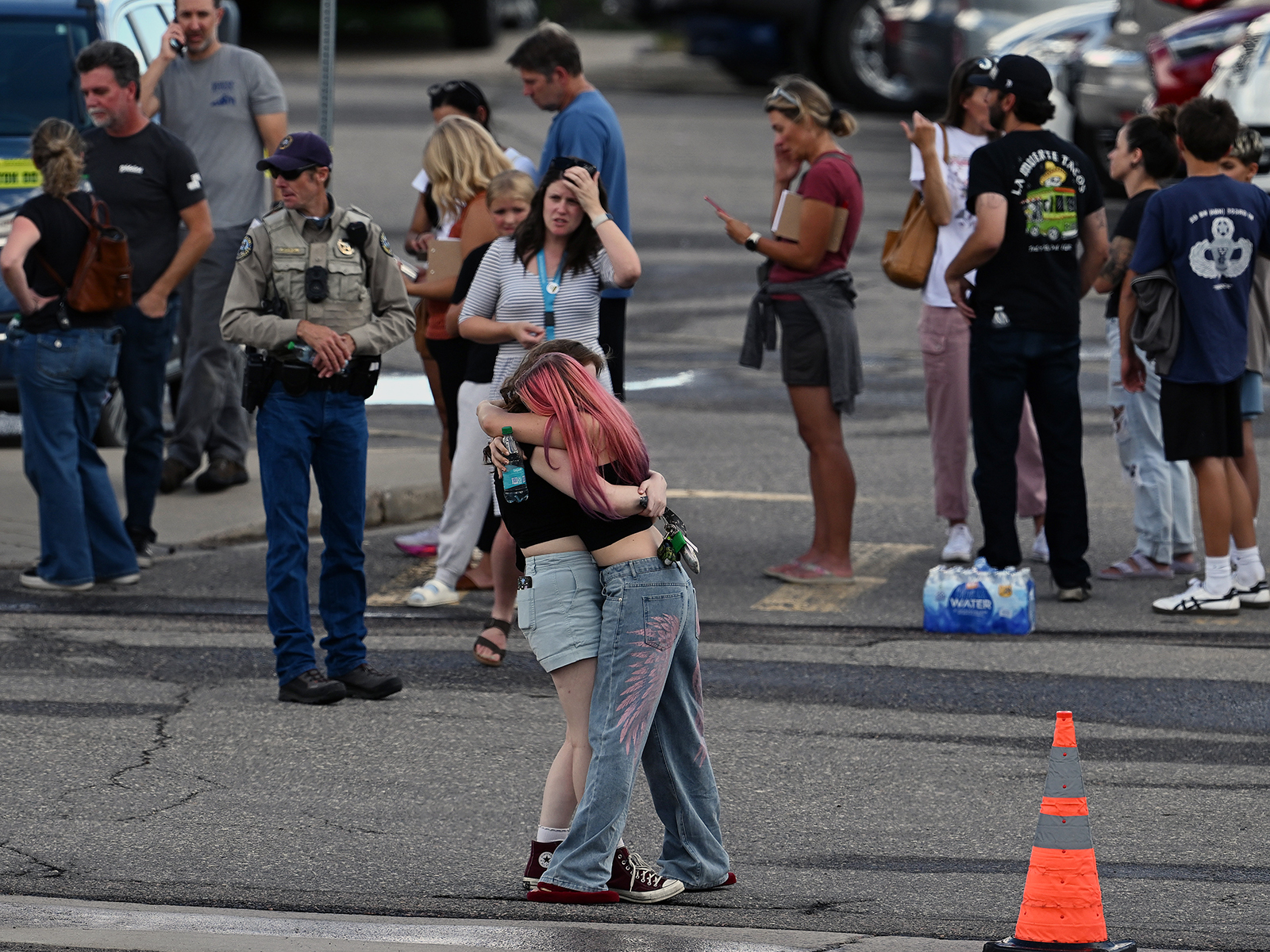 Students reunite with loved ones and classmates outside Bergen Meadow Elementary School after a shooting at Evergreen High School in Evergreen