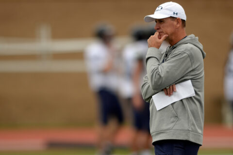 Bob Stitt looks on during practice