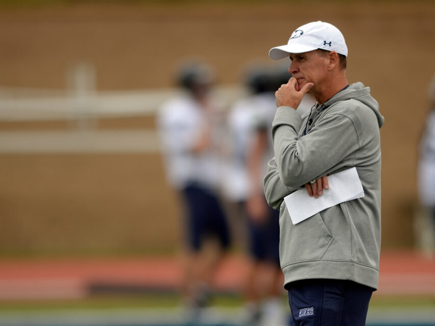 Bob Stitt looks on during practice