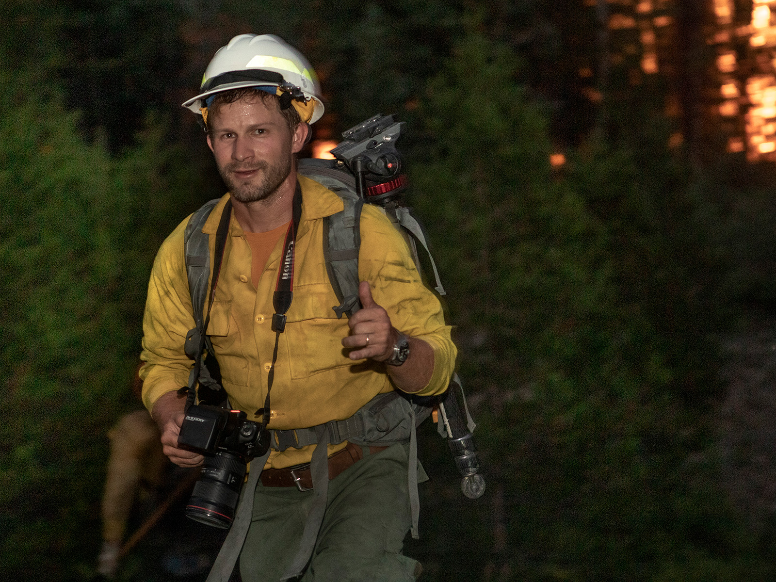 Man gives a thumbs up to the camera