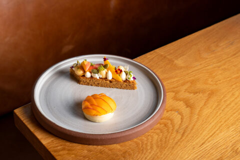 A plate with a tart and bread