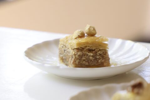 A piece of baklava on a white plate