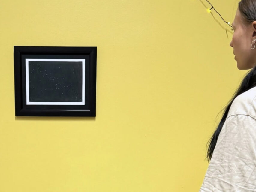 “Helsinki” by artist Gora hanging on a yellow wall