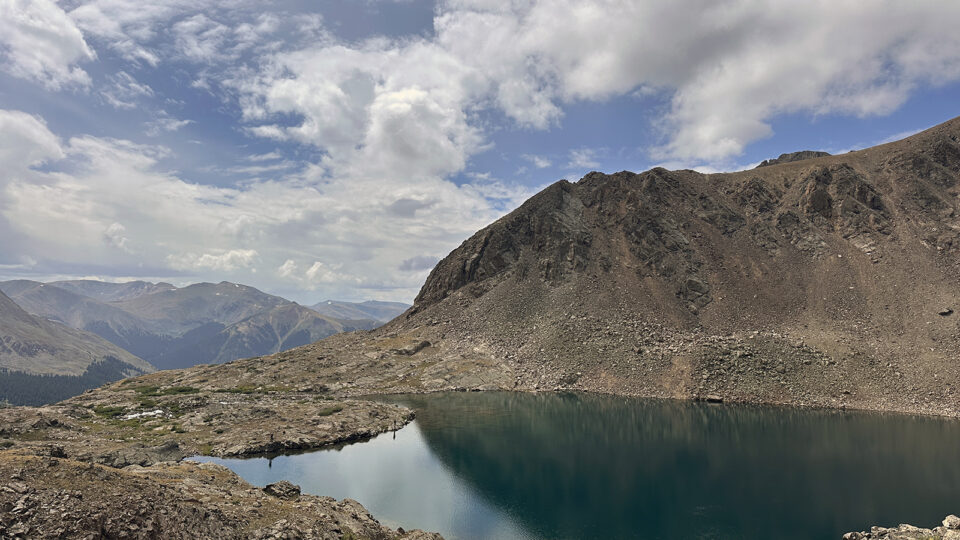 Chihuahua Lake under blue, cloudy skies