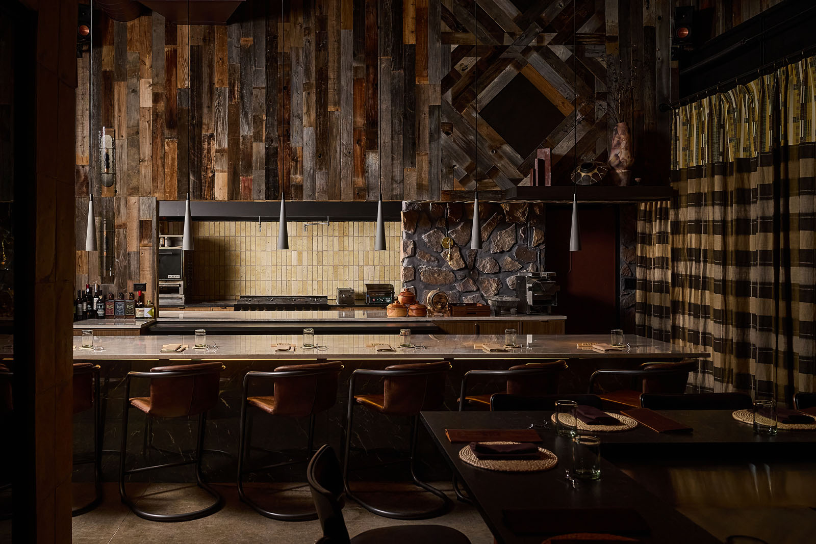 Milpero's hot counter surrounded by dark wood and stone