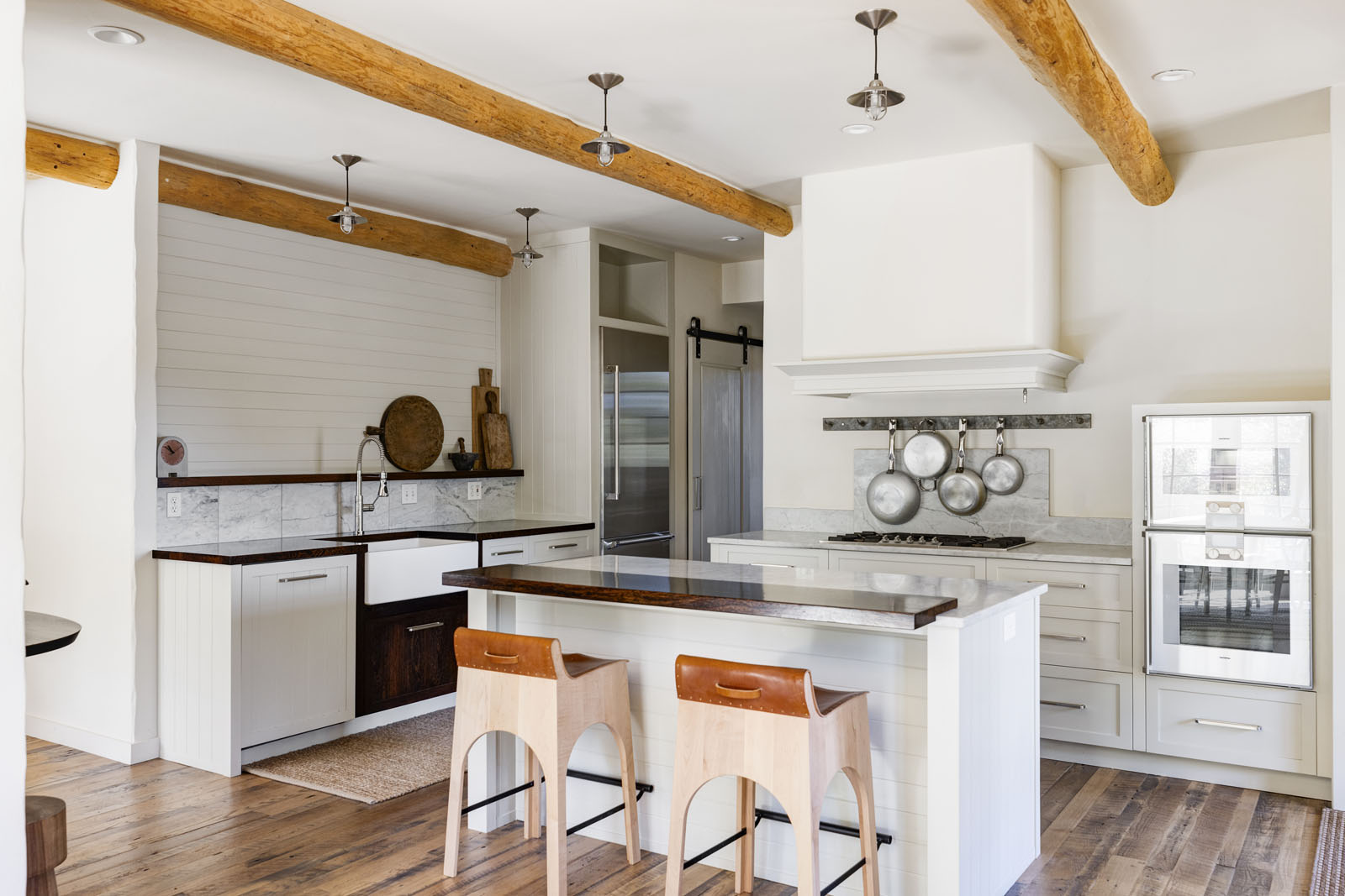 Kitchen with an island and wood beams