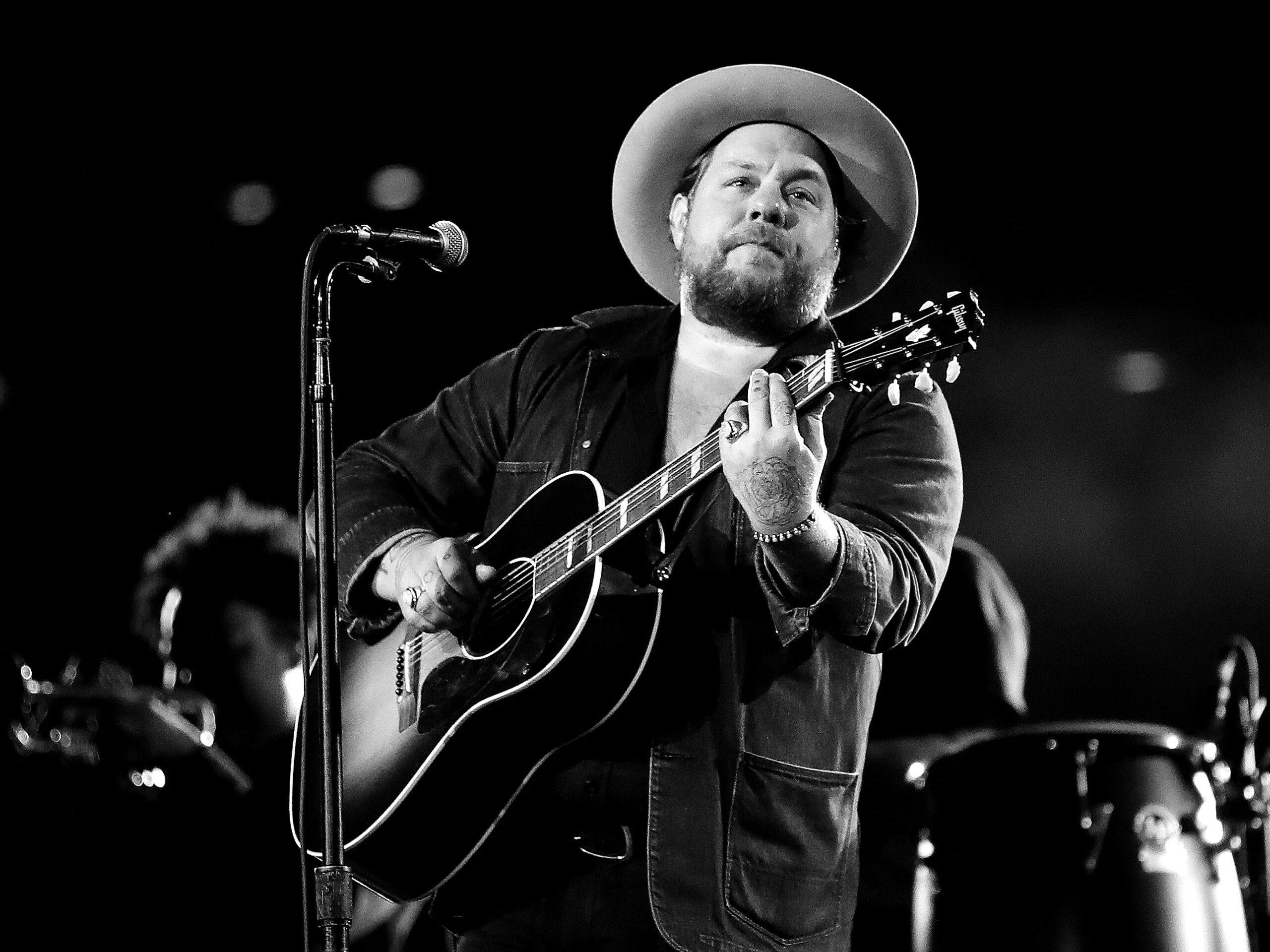 Nathaniel Rateliff playing a guitar