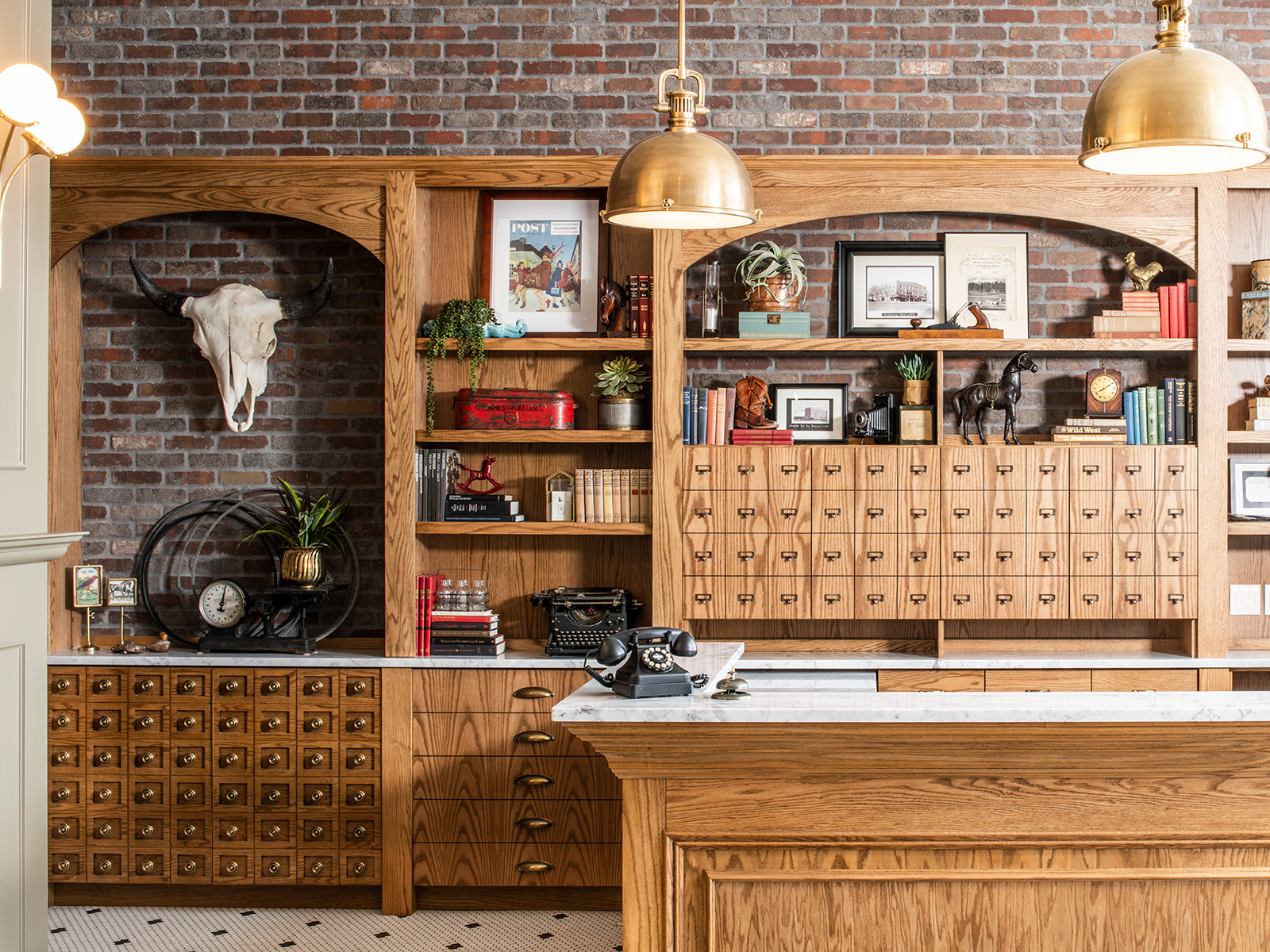 Wooden reception desk with gold light fixtures