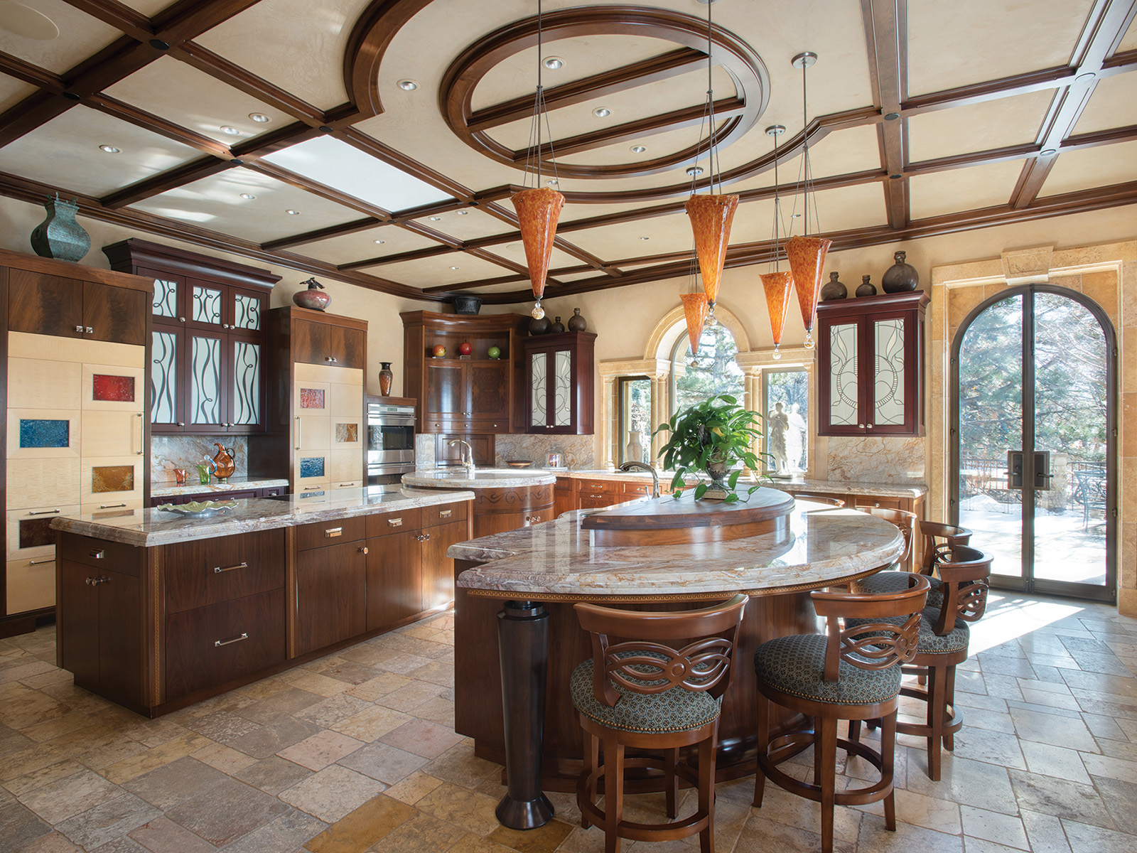 Wooden kitchen with orange pendant lights
