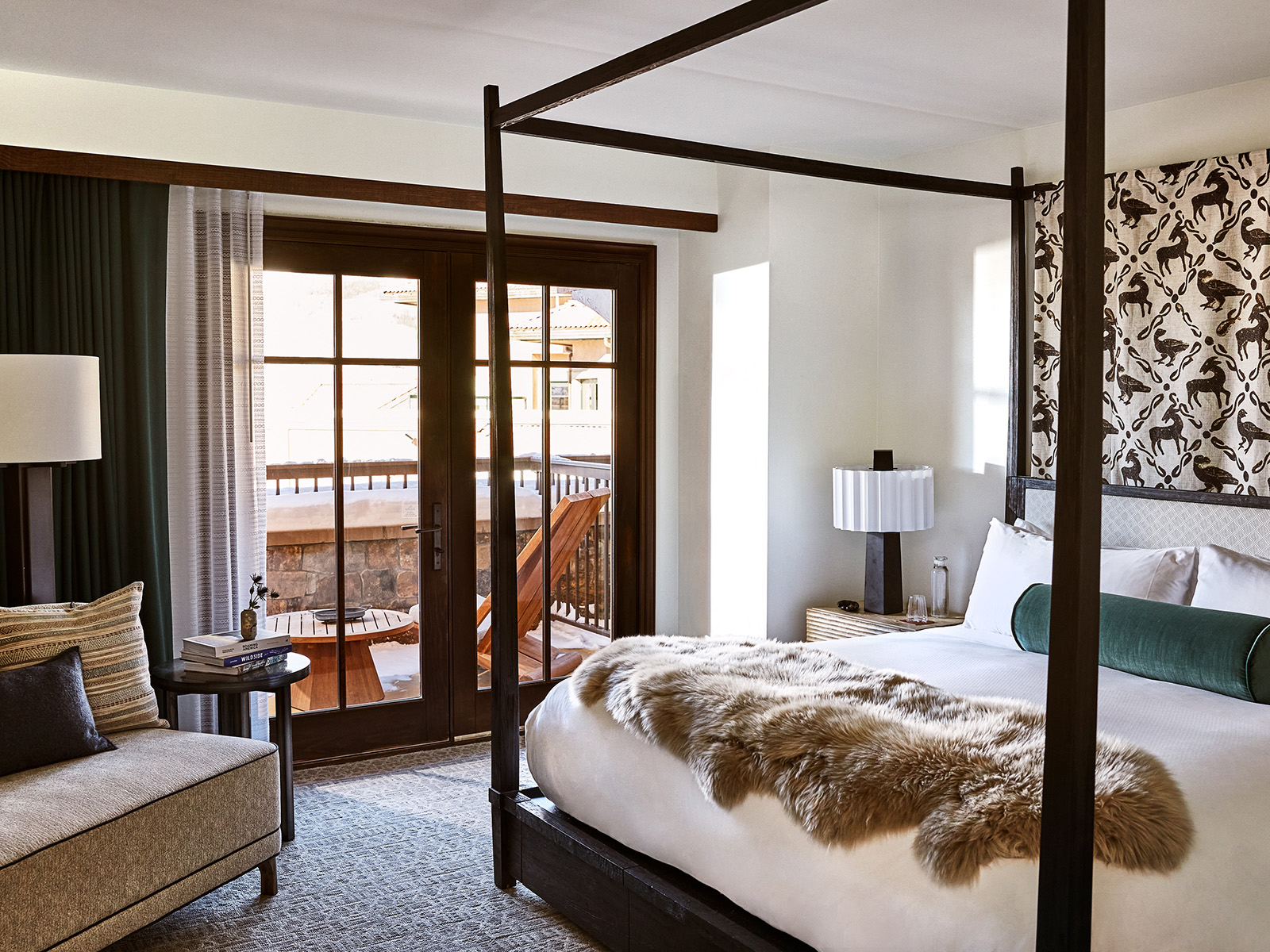 Guestoom with a king bed and French doors onto a patio