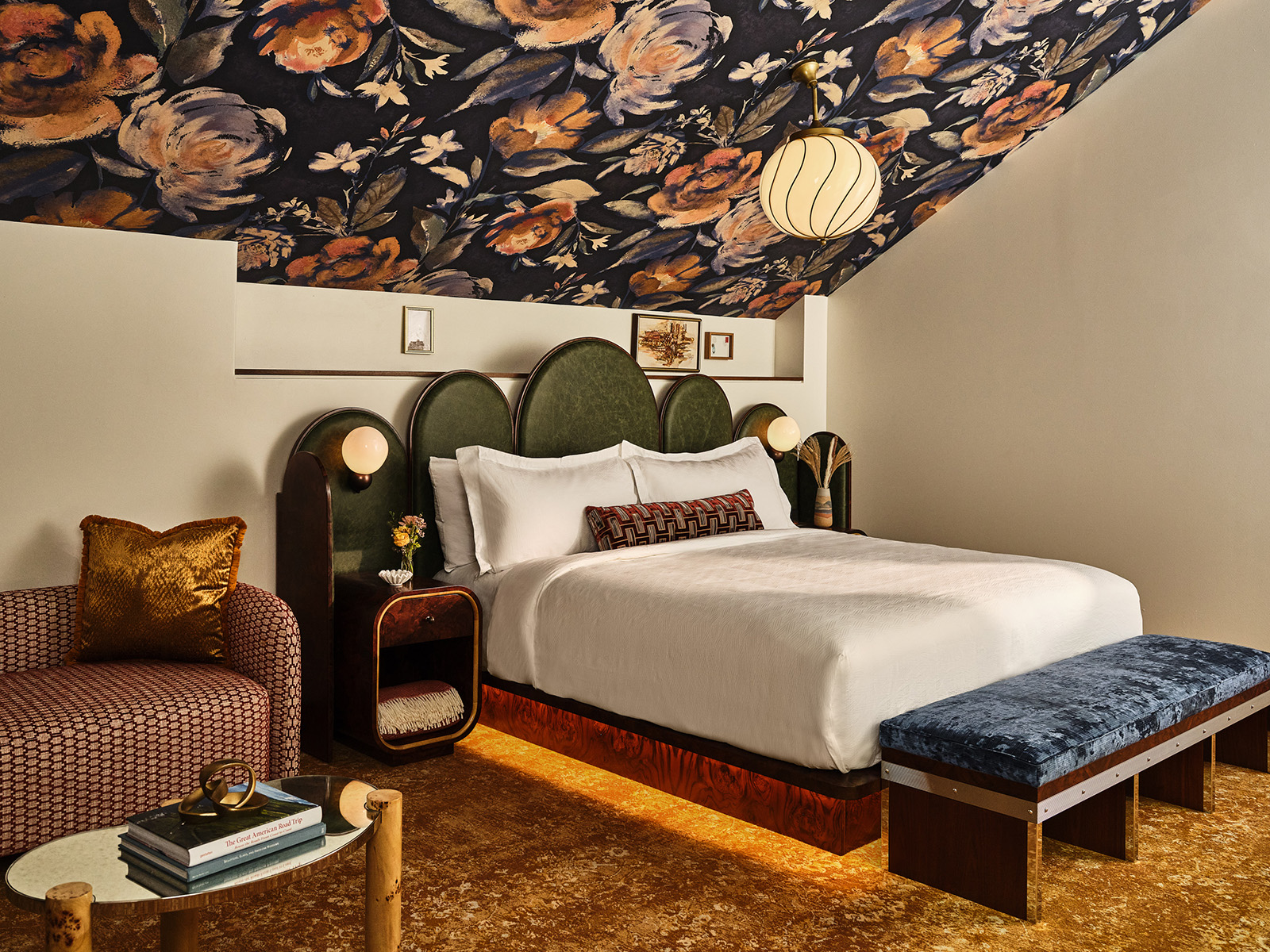 Hotel room with a floral ceiling and a king-size bed