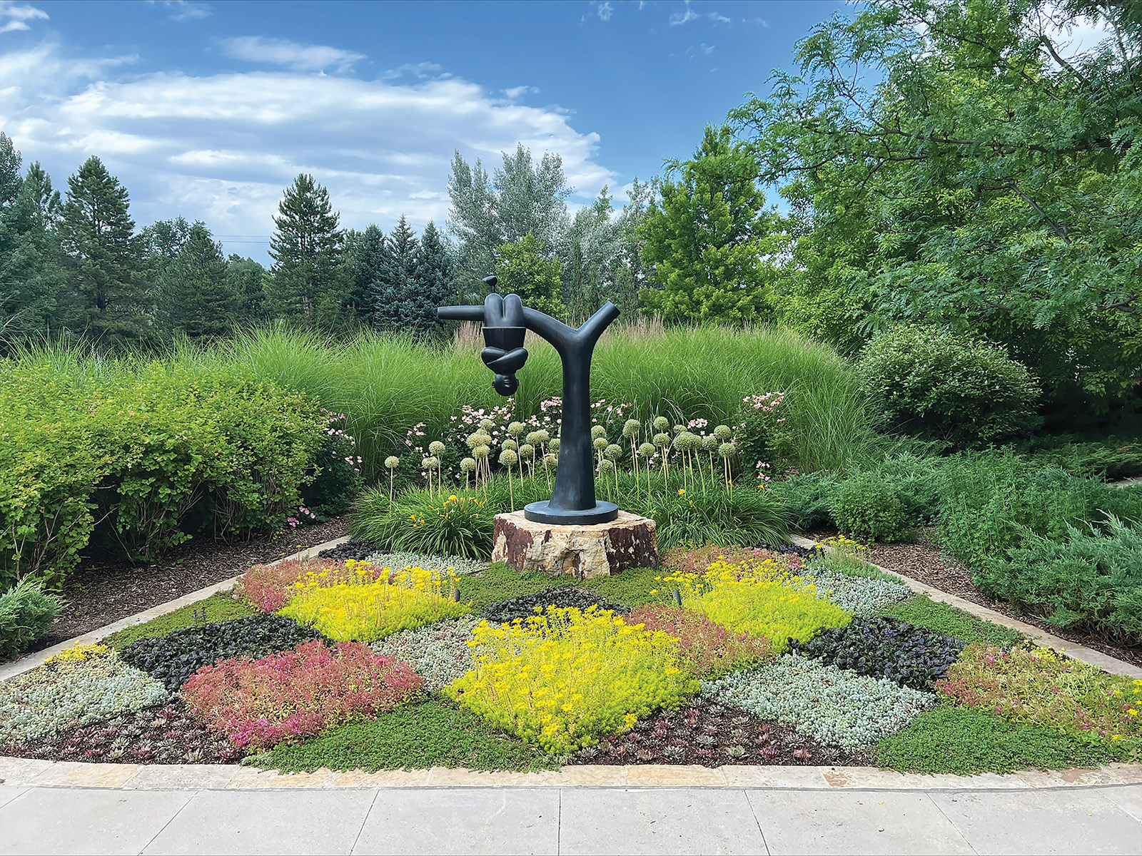 Sculpture of a person handing upside down