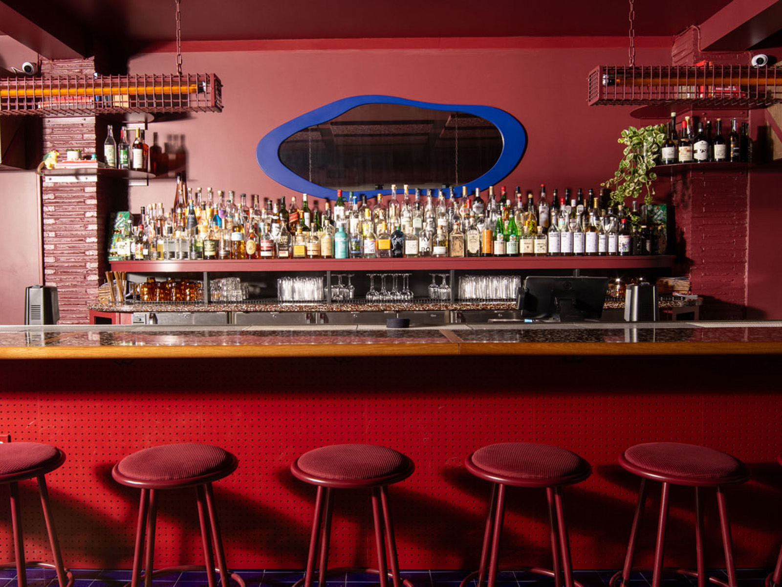 Red bar with a wavy blue mirror