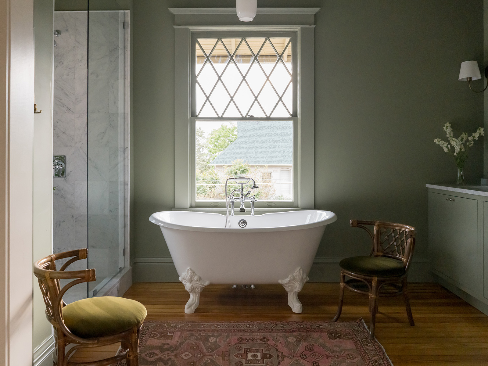 Sagre green bathroom with a clawfoot tub