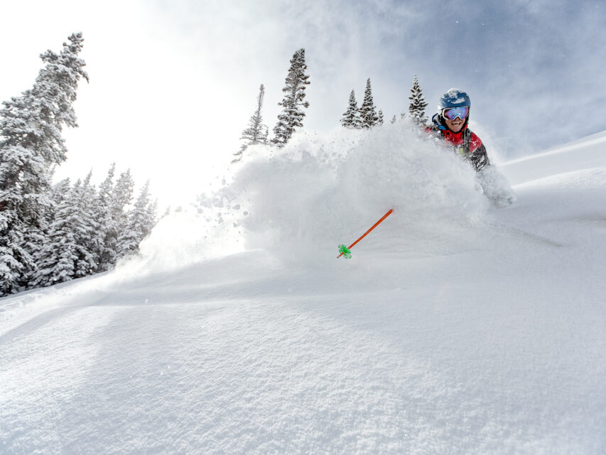 A very happy skier in waist-deep powder at Beaver Creek Resort in Colorado