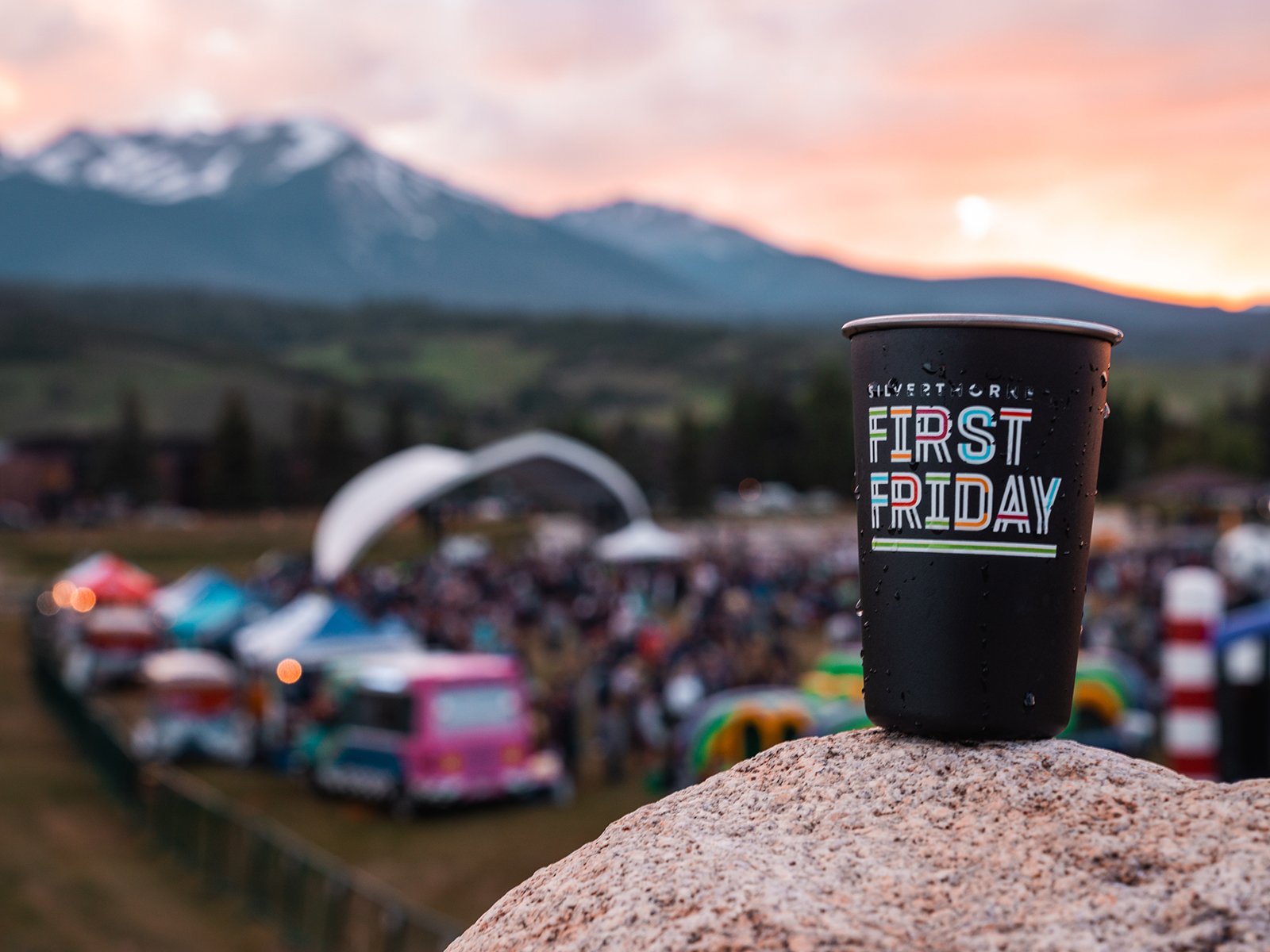 A cup that says First Friday on a rock in front of the festival in Silverthorne, Colorado