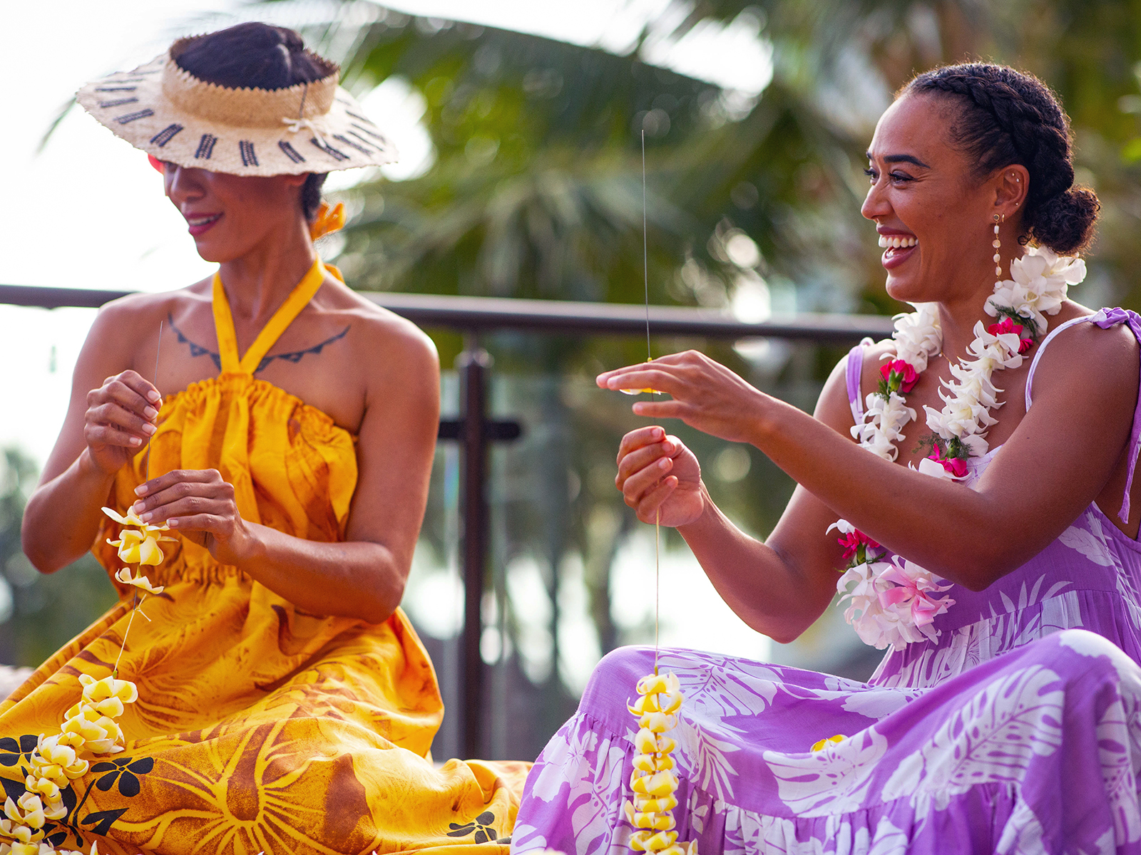 Women stringing leis in Honolulu