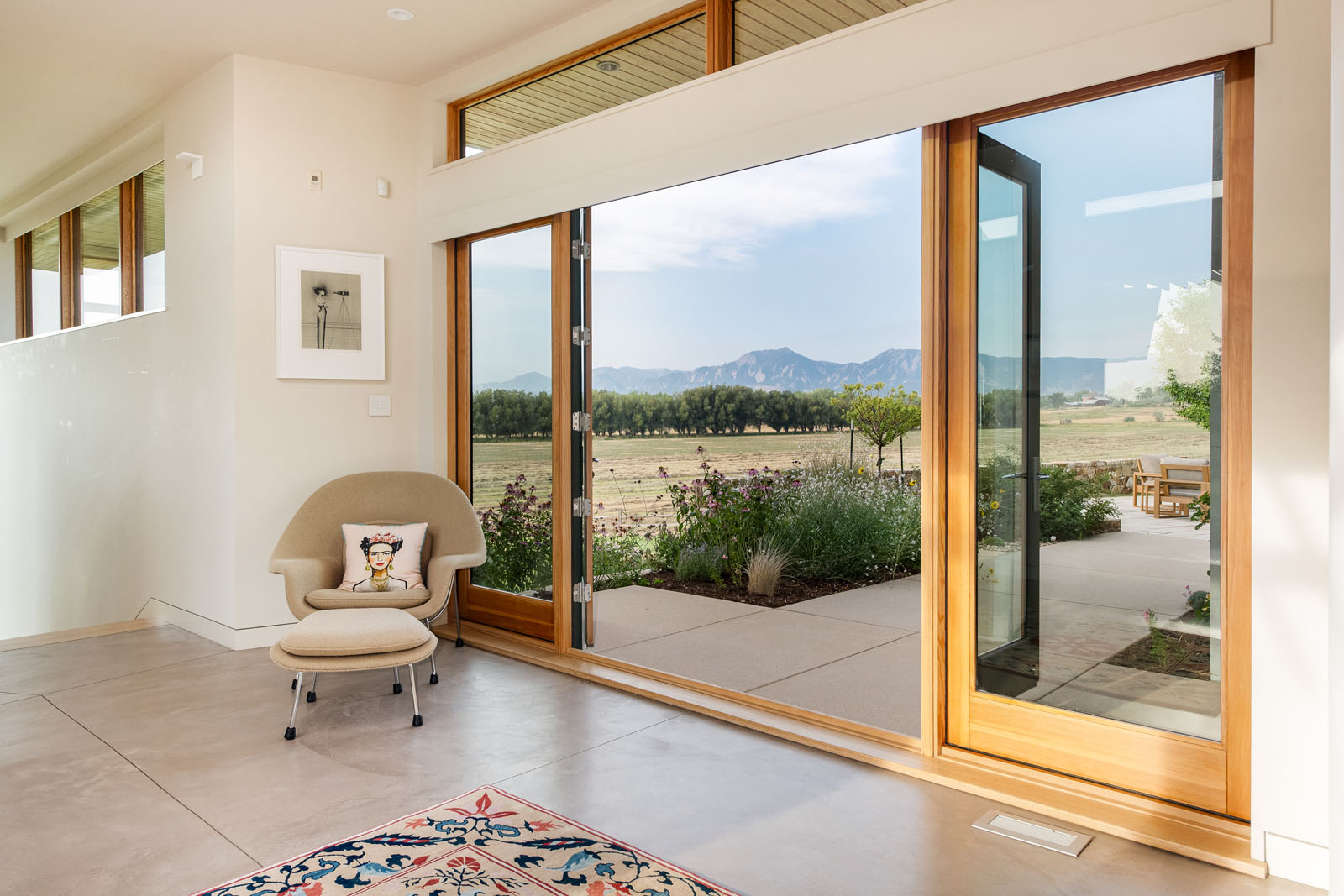 Large french doors open to sprawling field