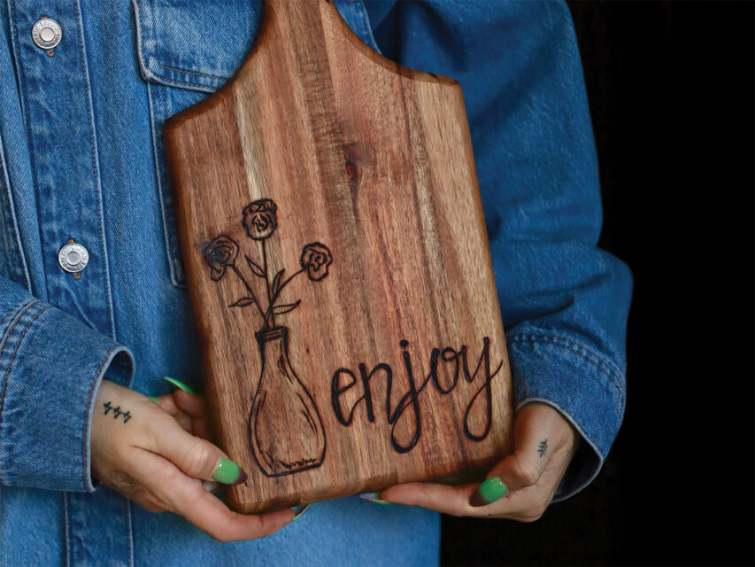 A wood-burned charcuterie board