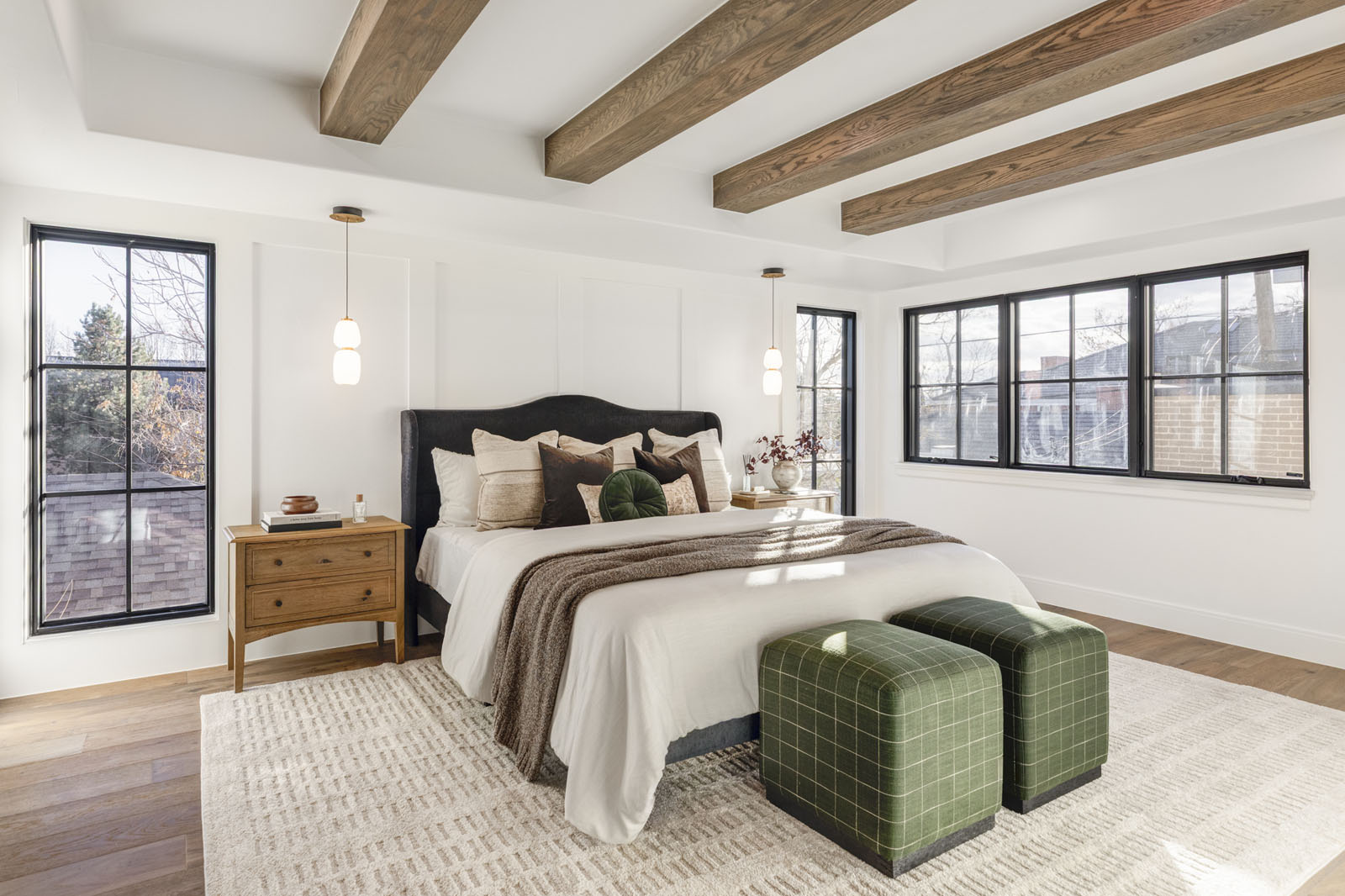 Primary bedroom with exposed wood beams