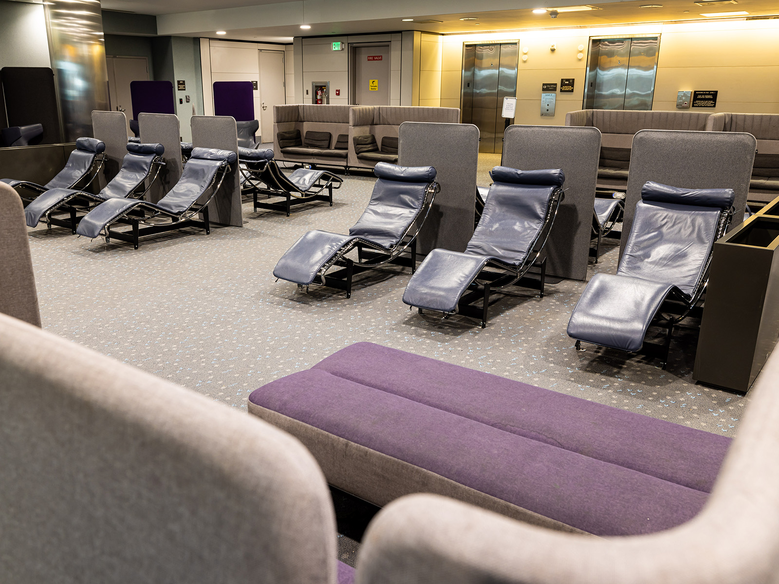 Area in airport with lounge chairs