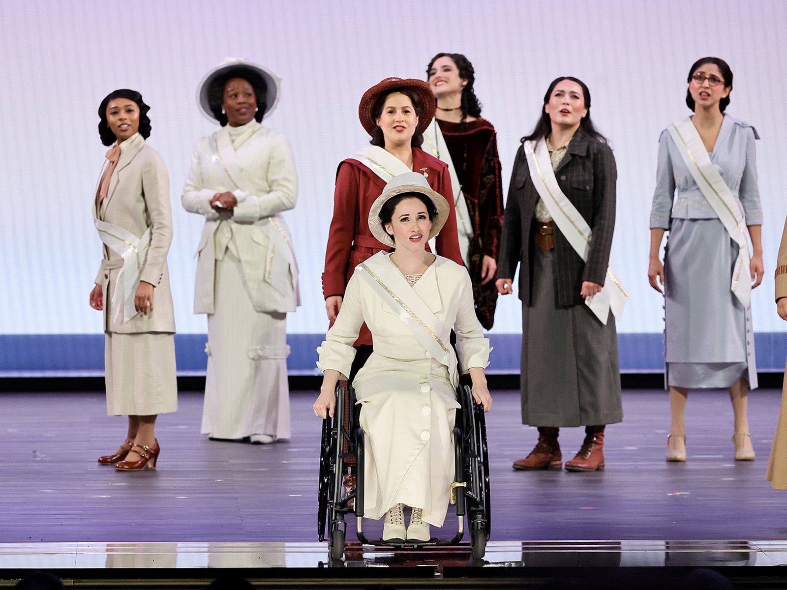 Jenna Bainbridge performing in Suffs