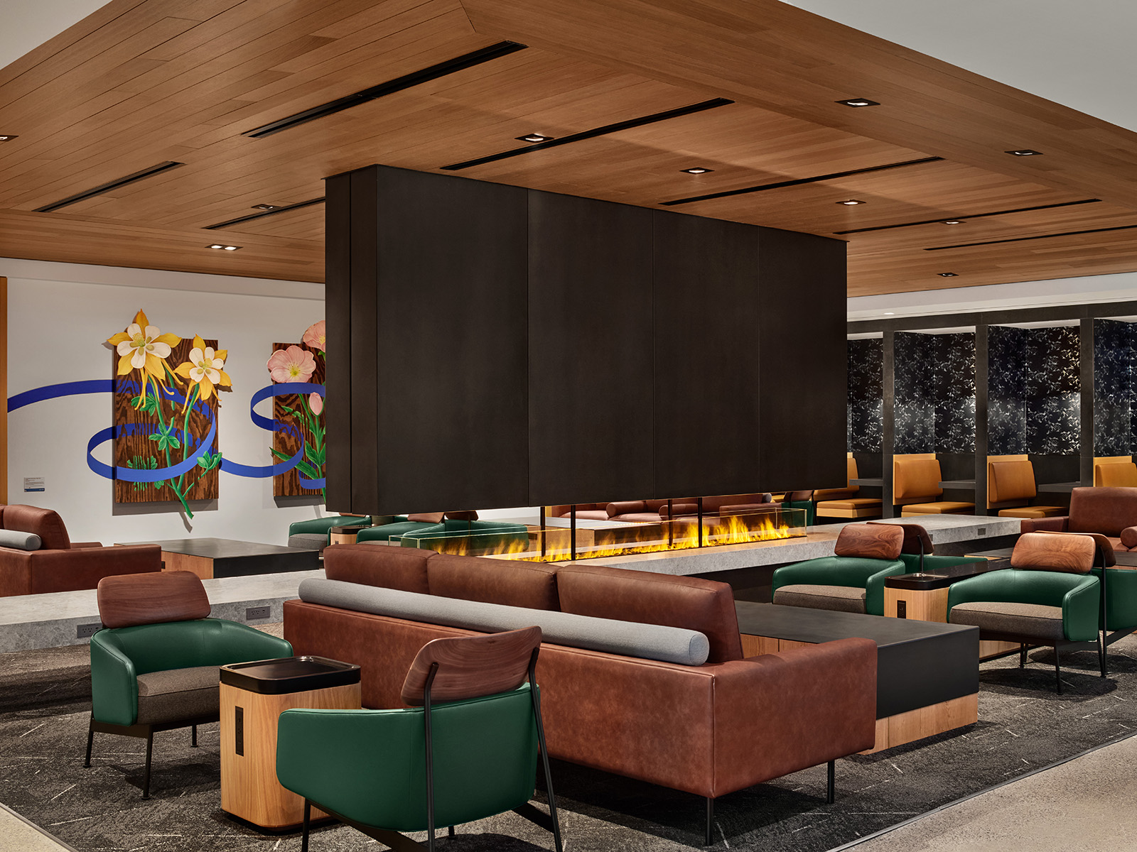 Airport lounge with a fireplace and seating