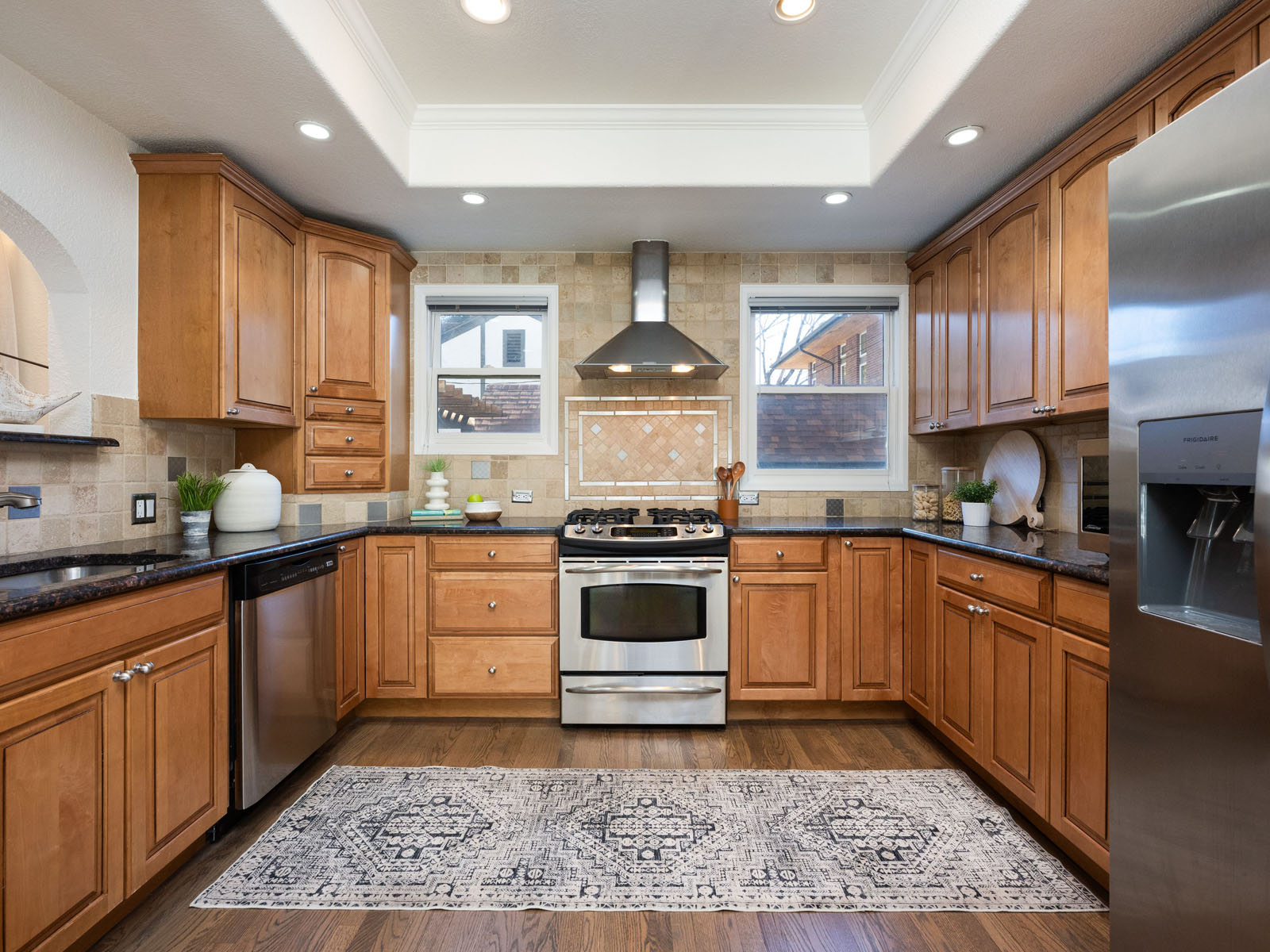 Kitchen with wood cabinetry and a gas stove