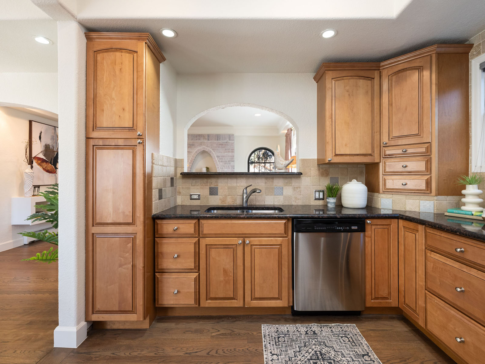 Kitchen with a small interior window over the sink