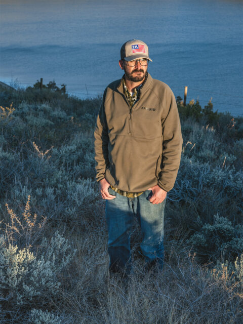 Rancher Doug Bruchez in a field