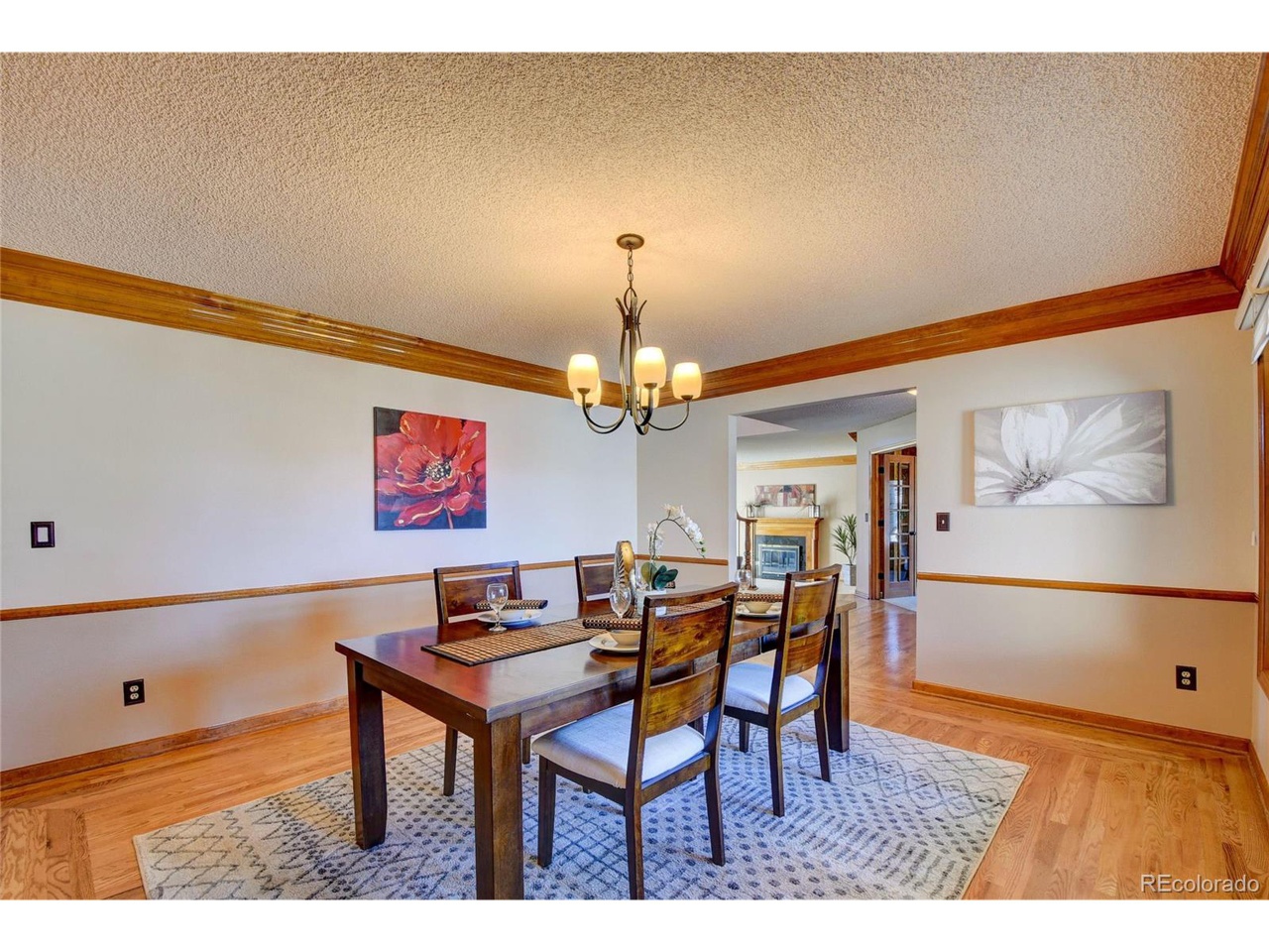 White dining room with wood molding