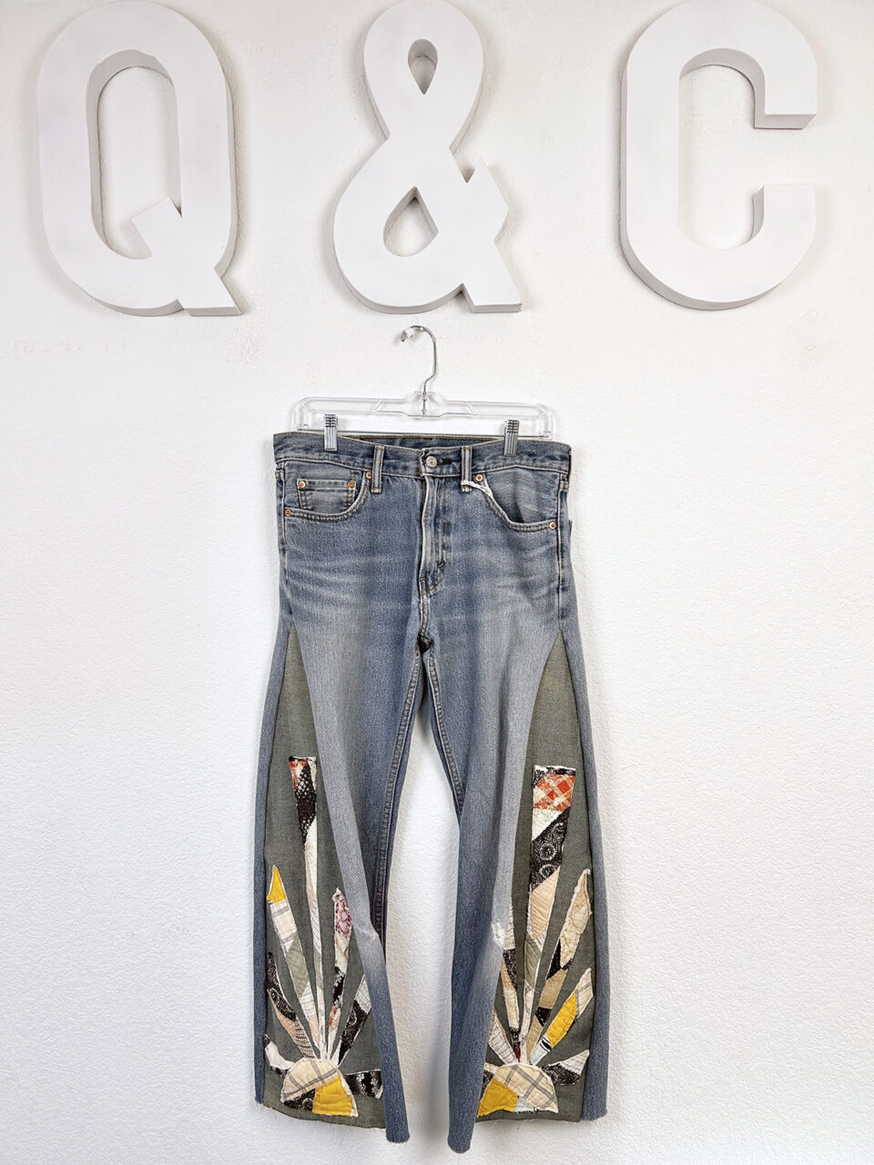 Vintage jeans with quilted patterning on the bottoms and sides