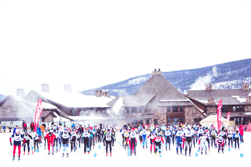 A group of people preparing to start a race in the snow.