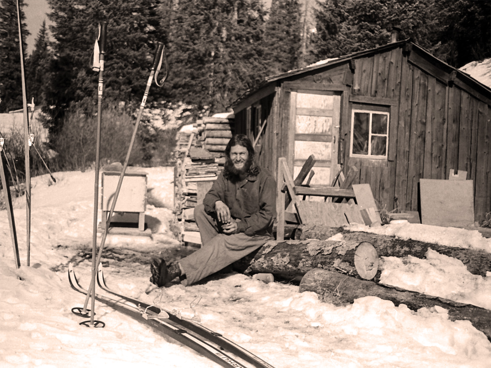 Billy Barr sits outside his cabin in 1977