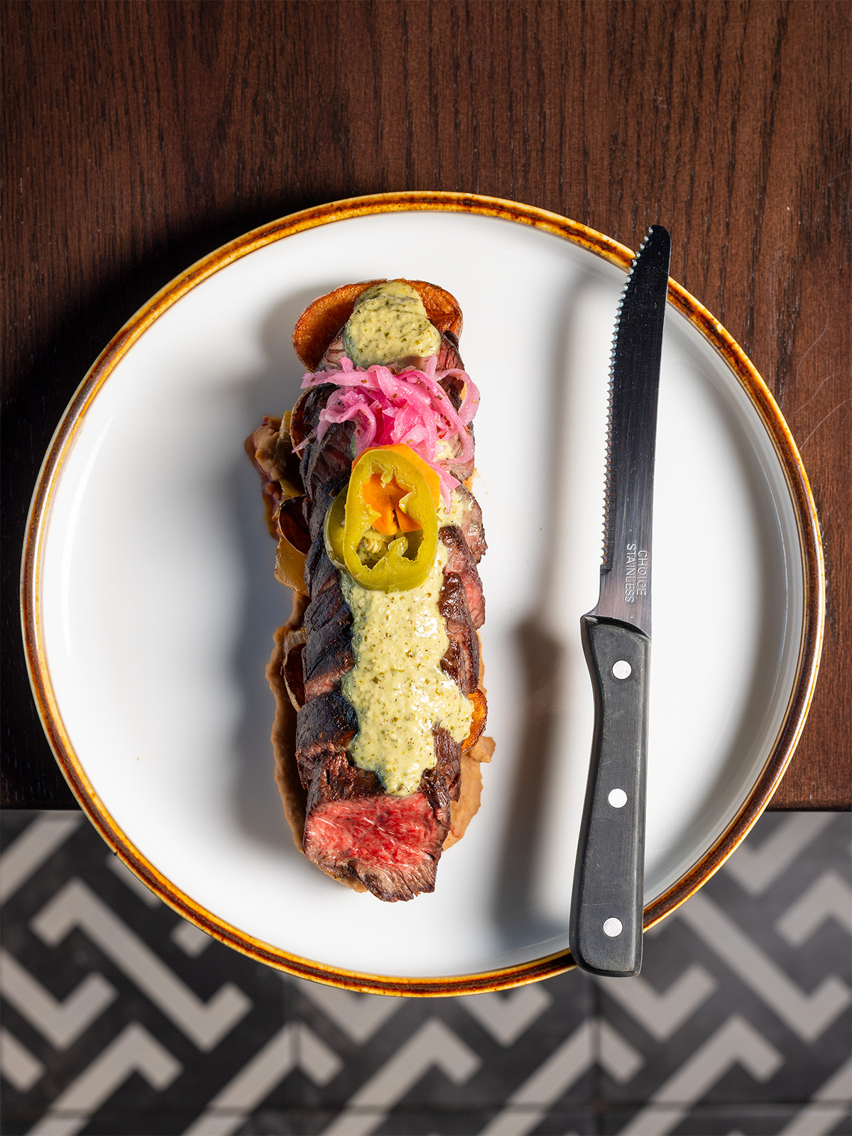 Carne asada topped with creamy chimichurri