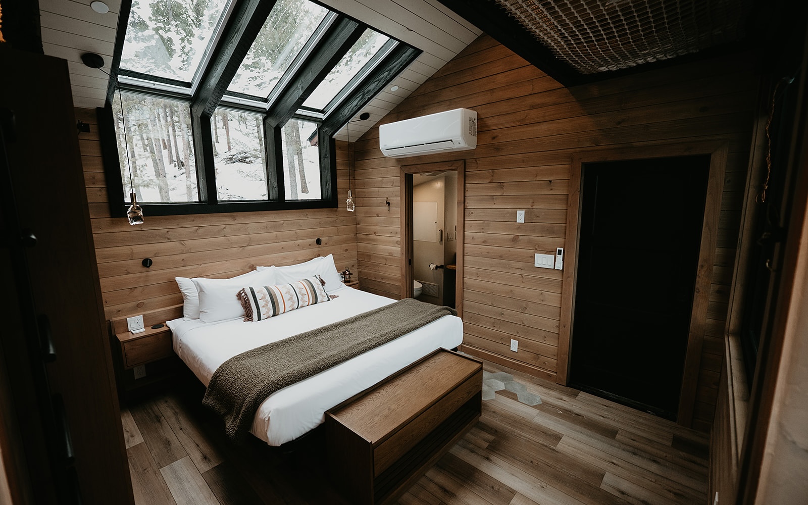A bed with windows above